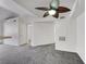 Carpeted living room featuring a ceiling fan and access to other rooms at 231 W Horizon Ridge Pkwy # 527, Henderson, NV 89012