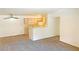 Open concept living space including kitchen area and living area with carpet at 231 W Horizon Ridge Pkwy # 527, Henderson, NV 89012