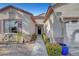 Landscaped walkway leading to the front door and two car garage of the house at 2520 Eclipsing Stars Dr, Henderson, NV 89044