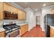 Updated kitchen featuring stainless steel appliances, granite countertops, and wood floors at 2520 Eclipsing Stars Dr, Henderson, NV 89044