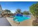 Backyard pool with built-in spa and lush greenery creates a relaxing outdoor retreat at 2520 Eclipsing Stars Dr, Henderson, NV 89044