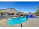 Inviting backyard pool surrounded by desert landscaping, perfect for outdoor entertaining and relaxation at 2520 Eclipsing Stars Dr, Henderson, NV 89044