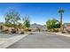 Serene street view with mature trees and mountain views, showcasing a peaceful neighborhood ambiance at 2520 Eclipsing Stars Dr, Henderson, NV 89044