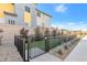 Enclosed dog run offers a secure outdoor space for pets, complemented by well-maintained landscaping and modern architectural details at 2536 Catallo St, Henderson, NV 89044