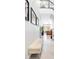 Bright hallway with modern decor, leading to an open-concept living space and staircase at 2536 Catallo St, Henderson, NV 89044