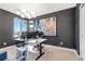 Stylish home office with large windows, modern lighting, and dark accent wall at 2536 Catallo St, Henderson, NV 89044