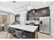 Modern kitchen featuring stainless steel appliances, an island with seating, and sleek cabinetry at 2536 Catallo St, Henderson, NV 89044