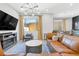 Cozy living room with modern fireplace, stylish furnishings, and plenty of natural light at 2536 Catallo St, Henderson, NV 89044