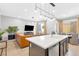 Bright, open-concept living room featuring modern lighting and stylish furnishings at 2536 Catallo St, Henderson, NV 89044