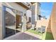 Private patio area with artificial grass, pavers, and outdoor seating at 2536 Catallo St, Henderson, NV 89044