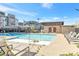Inviting community pool with lounge chairs and clear blue water, perfect for relaxation at 2536 Catallo St, Henderson, NV 89044