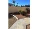 Landscaped backyard featuring desert landscaping with mature shrubs, providing privacy and a serene outdoor space at 2711 Seabridge Dr, Las Vegas, NV 89121