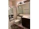 Cozy bathroom featuring a shower-tub combo, decorative tiling, a vanity, and tiled flooring at 2711 Seabridge Dr, Las Vegas, NV 89121