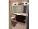 Bathroom with a toilet, cabinets, and a shower behind a glass door at 2711 Seabridge Dr, Las Vegas, NV 89121