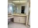 A bathroom features a white sink and tiled countertop at 2711 Seabridge Dr, Las Vegas, NV 89121