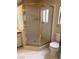 Bathroom showcasing a glass shower with gold trim and white subway tile at 2711 Seabridge Dr, Las Vegas, NV 89121