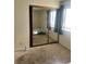 A bedroom with carpet floor and a closet with mirrored doors at 2711 Seabridge Dr, Las Vegas, NV 89121