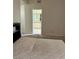 A bedroom with carpet flooring and a view of the bathroom at 2711 Seabridge Dr, Las Vegas, NV 89121