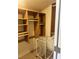 A closet with wooden shelves and a laundry basket at 2711 Seabridge Dr, Las Vegas, NV 89121