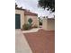 Exterior features a privacy wall, gate, and desert landscaping at 2711 Seabridge Dr, Las Vegas, NV 89121