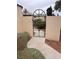 Exterior view through the gate to the backyard of the home at 2711 Seabridge Dr, Las Vegas, NV 89121