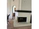 Classic white-brick fireplace in the living area with dark wood mantle at 2711 Seabridge Dr, Las Vegas, NV 89121