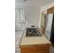 Kitchen island with cooktop and stainless steel refrigerator at 2711 Seabridge Dr, Las Vegas, NV 89121