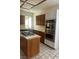 Galley style kitchen with tile floors and stainless steel oven at 2711 Seabridge Dr, Las Vegas, NV 89121