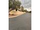 Street view of a residential neighborhood and desert landscaping at 2711 Seabridge Dr, Las Vegas, NV 89121