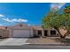 Charming single-story home features a well-maintained front yard, mature trees, and a two-car garage at 2913 Bradford Hill Ave, North Las Vegas, NV 89031