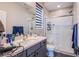 Bathroom featuring a glass shower and modern vanity with countertop at 3066 Casarano Ct, Henderson, NV 89044