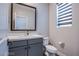 Half bathroom with modern vanity and toilet at 3066 Casarano Ct, Henderson, NV 89044