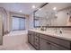 Beautiful bathroom with double vanity, large soaking tub, and glass shower with a window at 3066 Casarano Ct, Henderson, NV 89044