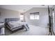 Large bedroom with luxury vinyl floors, neutral color, and lots of natural light at 3066 Casarano Ct, Henderson, NV 89044