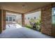 Covered patio with stone pillars, ceiling fan, a table, and barbecue grill at 3066 Casarano Ct, Henderson, NV 89044