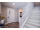 Welcoming entryway with wood floors, modern front door, and staircase to the upper level at 3066 Casarano Ct, Henderson, NV 89044