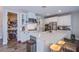 Bright kitchen with white cabinets, subway tile backsplash, stainless steel appliances, and a walk-in pantry at 3066 Casarano Ct, Henderson, NV 89044