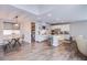 Bright open-concept kitchen and dining area with stainless steel appliances and a large island at 3066 Casarano Ct, Henderson, NV 89044