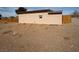 Vast backyard area with a wooden fence surrounding the property at 325 Ron Ave, Logandale, NV 89021