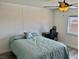 Bedroom with a ceiling fan, wood-style flooring, a desk and chair, and a window at 325 Ron Ave, Logandale, NV 89021