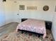 Bedroom with wood-style flooring and area rug, ceiling fan and furnishings at 325 Ron Ave, Logandale, NV 89021