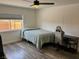 Bedroom with a ceiling fan and a window and a desk with a computer chair at 325 Ron Ave, Logandale, NV 89021