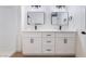 Modern bathroom featuring double sink vanities with black faucets and a separate shower stall at 3400 Cabana Dr # 1084, Las Vegas, NV 89122