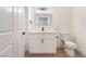 Bathroom featuring modern vanity, mirror and sink with light wood floors at 3400 Cabana Dr # 1084, Las Vegas, NV 89122