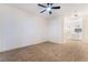 Spacious carpeted bedroom with ceiling fan and an ensuite bathroom featuring double sink vanities at 3400 Cabana Dr # 1084, Las Vegas, NV 89122