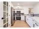 Modern kitchen with stainless steel appliances, sleek cabinets, and subway tile backsplash at 3400 Cabana Dr # 1084, Las Vegas, NV 89122