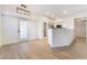 Bright living room featuring wood-look floors, modern fireplace, and open floor plan at 3400 Cabana Dr # 1084, Las Vegas, NV 89122