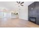 Bright living room featuring wood-look floors, modern fireplace, and open floor plan at 3400 Cabana Dr # 1084, Las Vegas, NV 89122