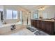 Bathroom with a tub, glass shower, dual sinks and granite countertop at 3531 Barrel Bronco Ct, North Las Vegas, NV 89032