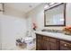 Cozy bathroom with tiled shower-tub combo and dark wood vanity at 3531 Barrel Bronco Ct, North Las Vegas, NV 89032